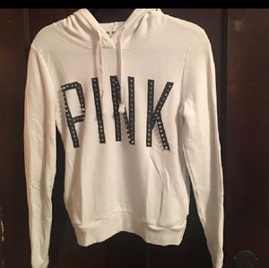 White hoodie with studs also has pockets